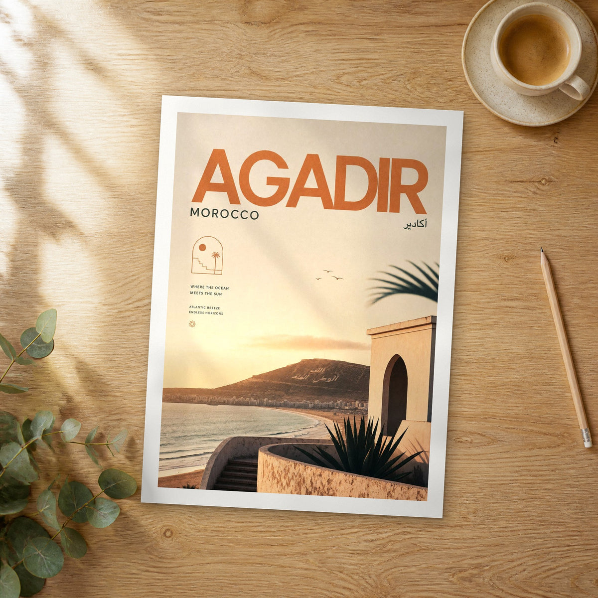 Unframed Agadir bold typography travel poster on a wooden table