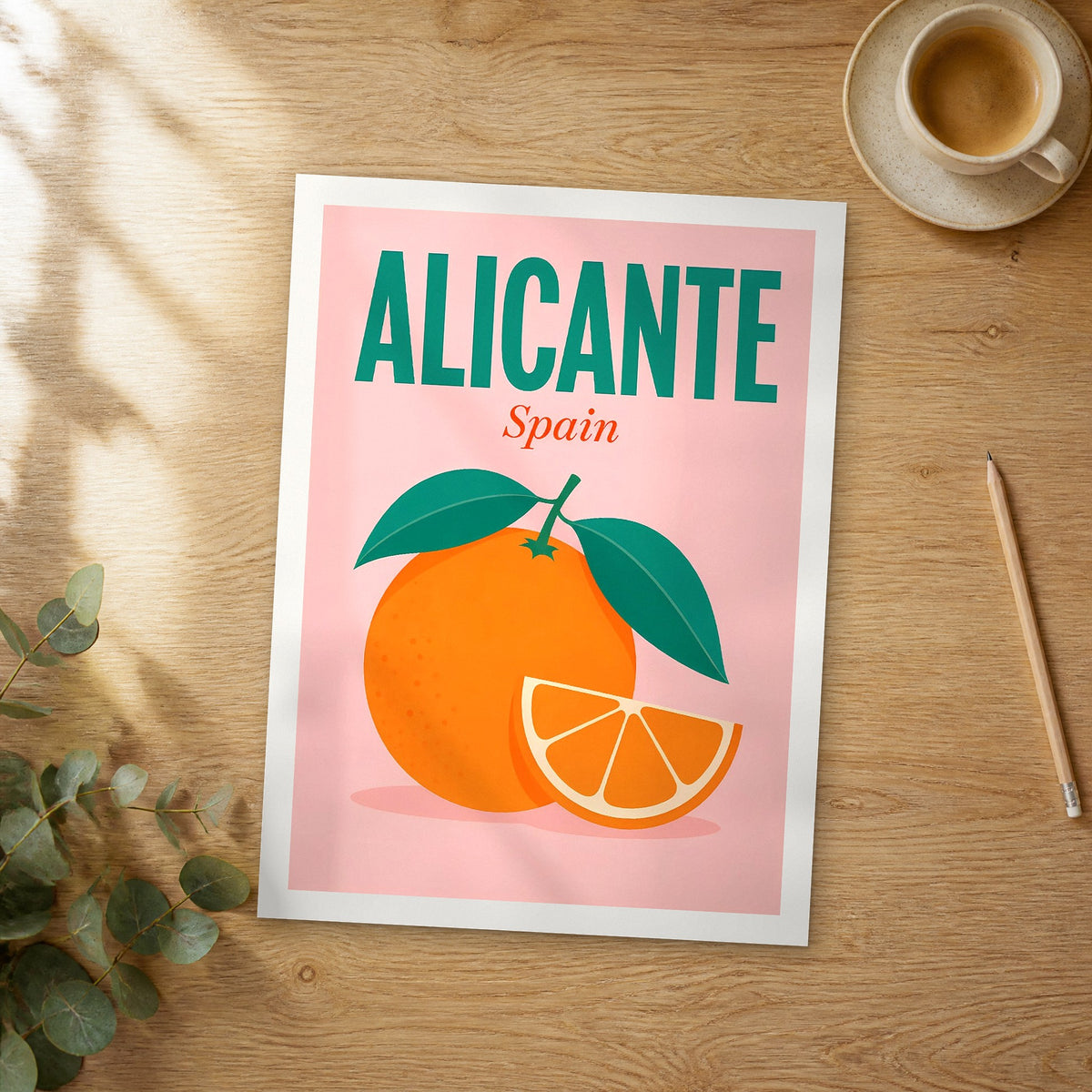 Unframed Alicante pop art travel poster on a wooden table