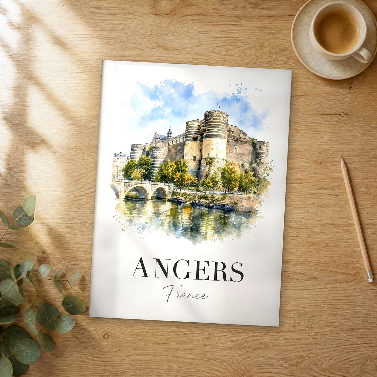 Unframed Angers watercolor travel poster on a wooden table