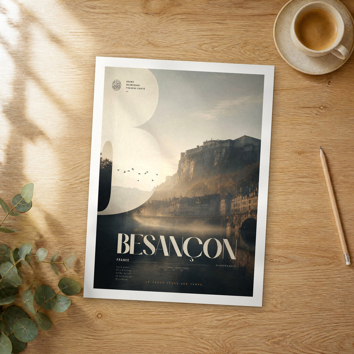 Unframed Besançon bold typography travel poster on a wooden table