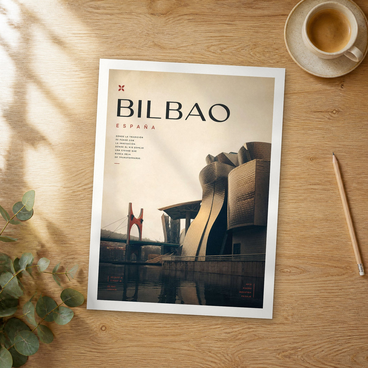 Unframed Bilbao Guggenheim and La Salve Bridge bold typography travel poster on a wooden table