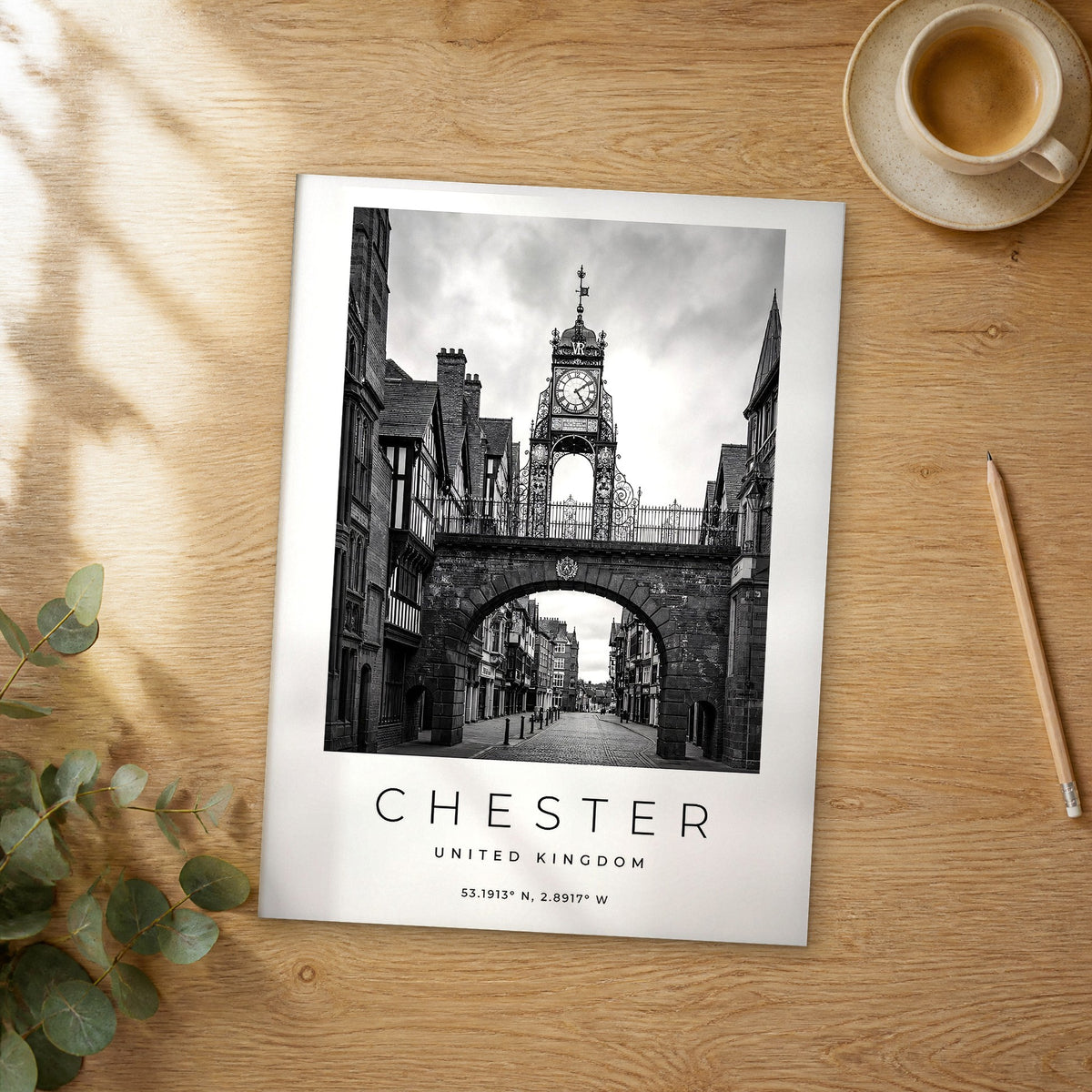 Unframed Chester black and white travel poster on a wooden table