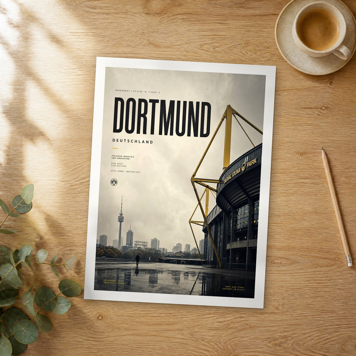Unframed Dortmund bold typography travel poster on a wooden table