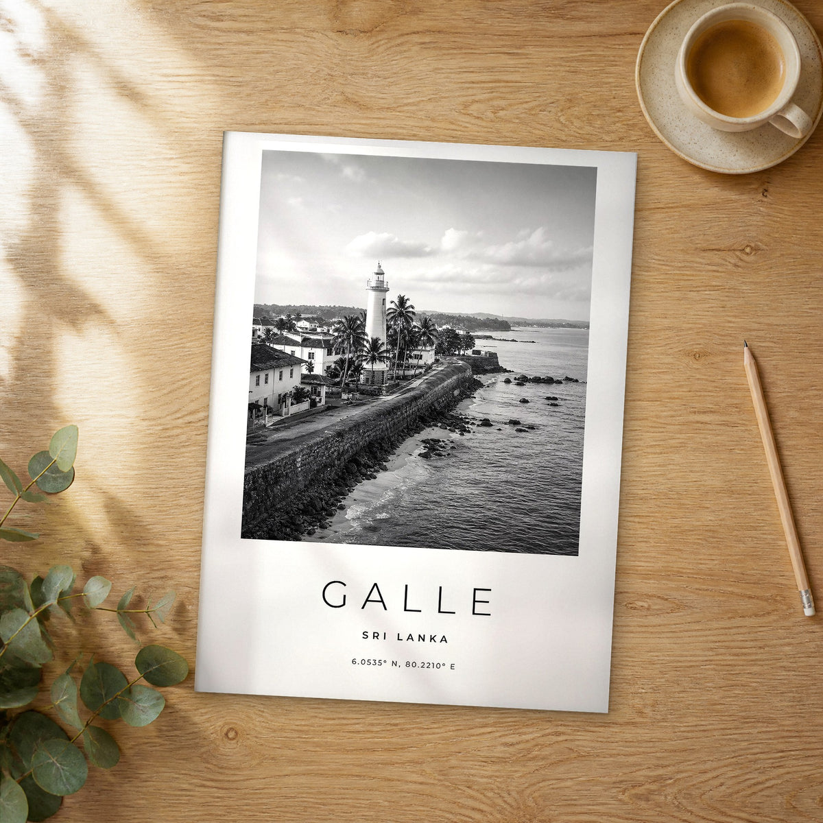 Unframed Galle black and white travel poster on a wooden table