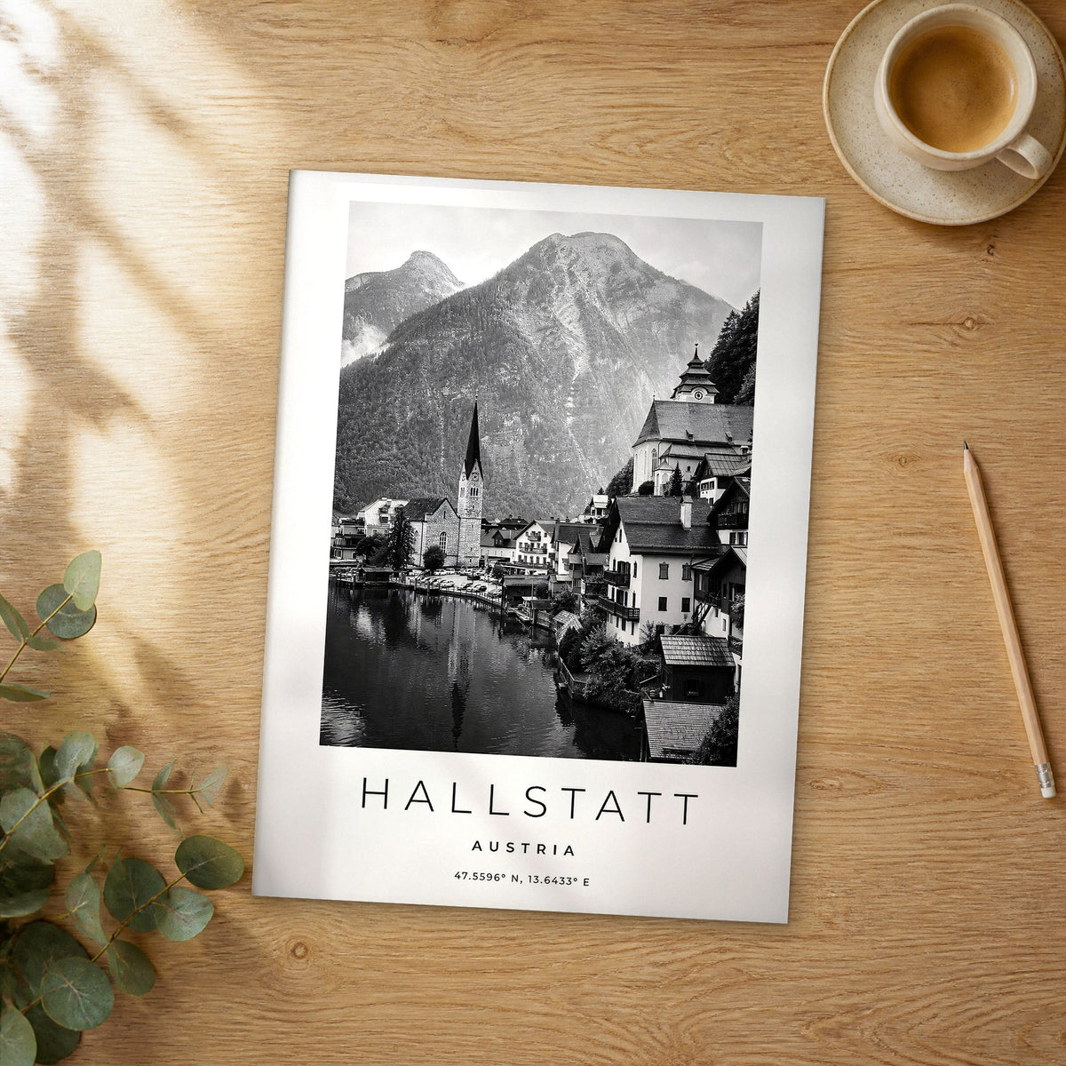 Unframed Hallstatt black and white travel poster on a wooden table
