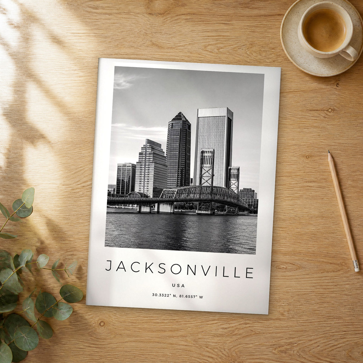 Unframed Jacksonville black and white travel poster on a wooden table