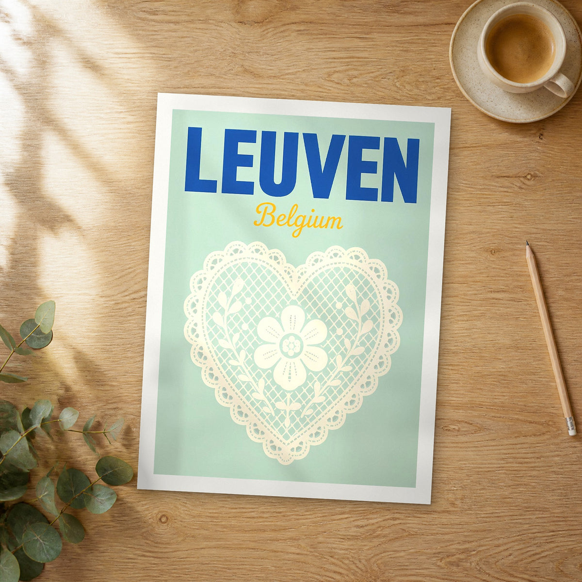 Unframed Leuven pop art travel poster on a wooden table