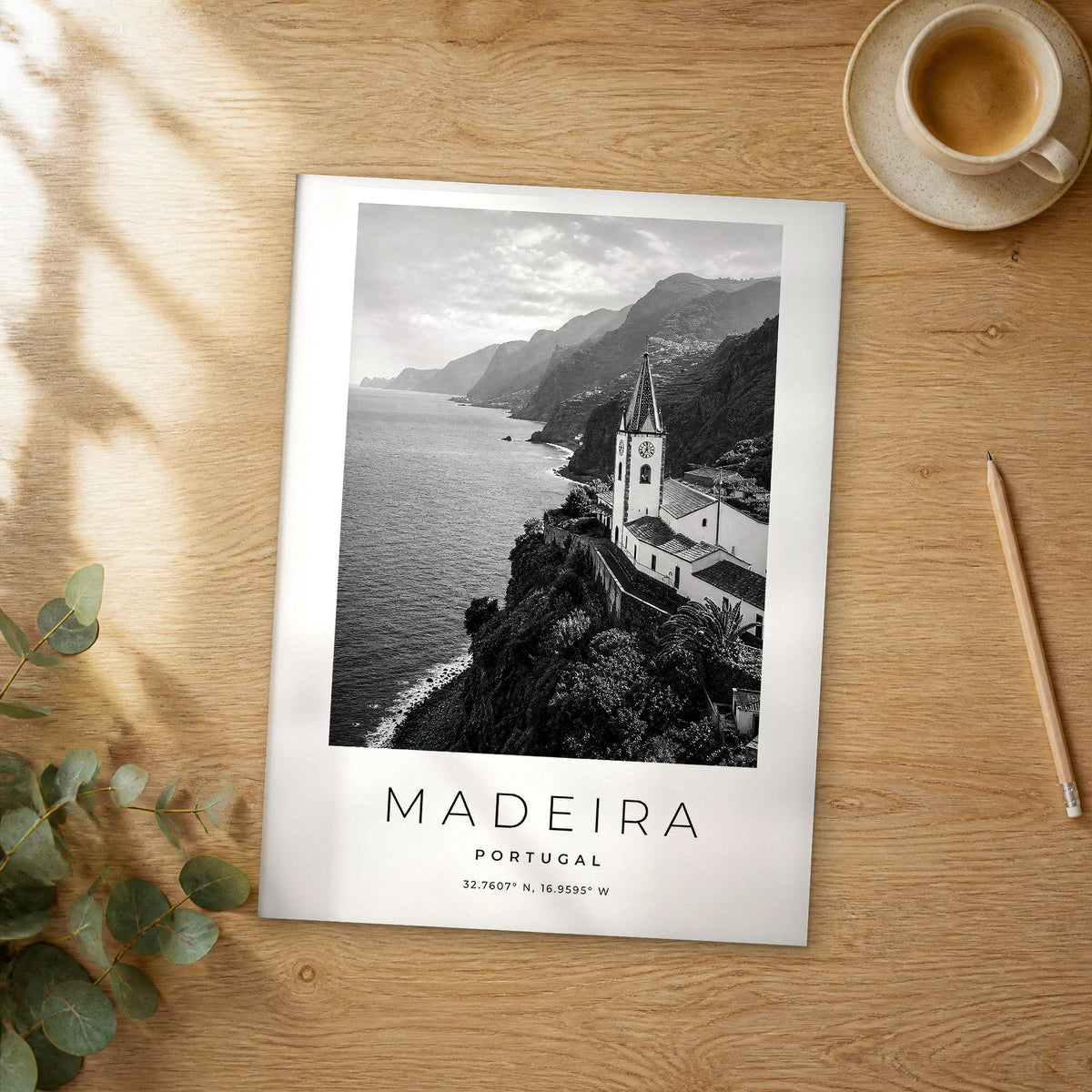 Unframed Madeira black and white travel poster on a wooden table