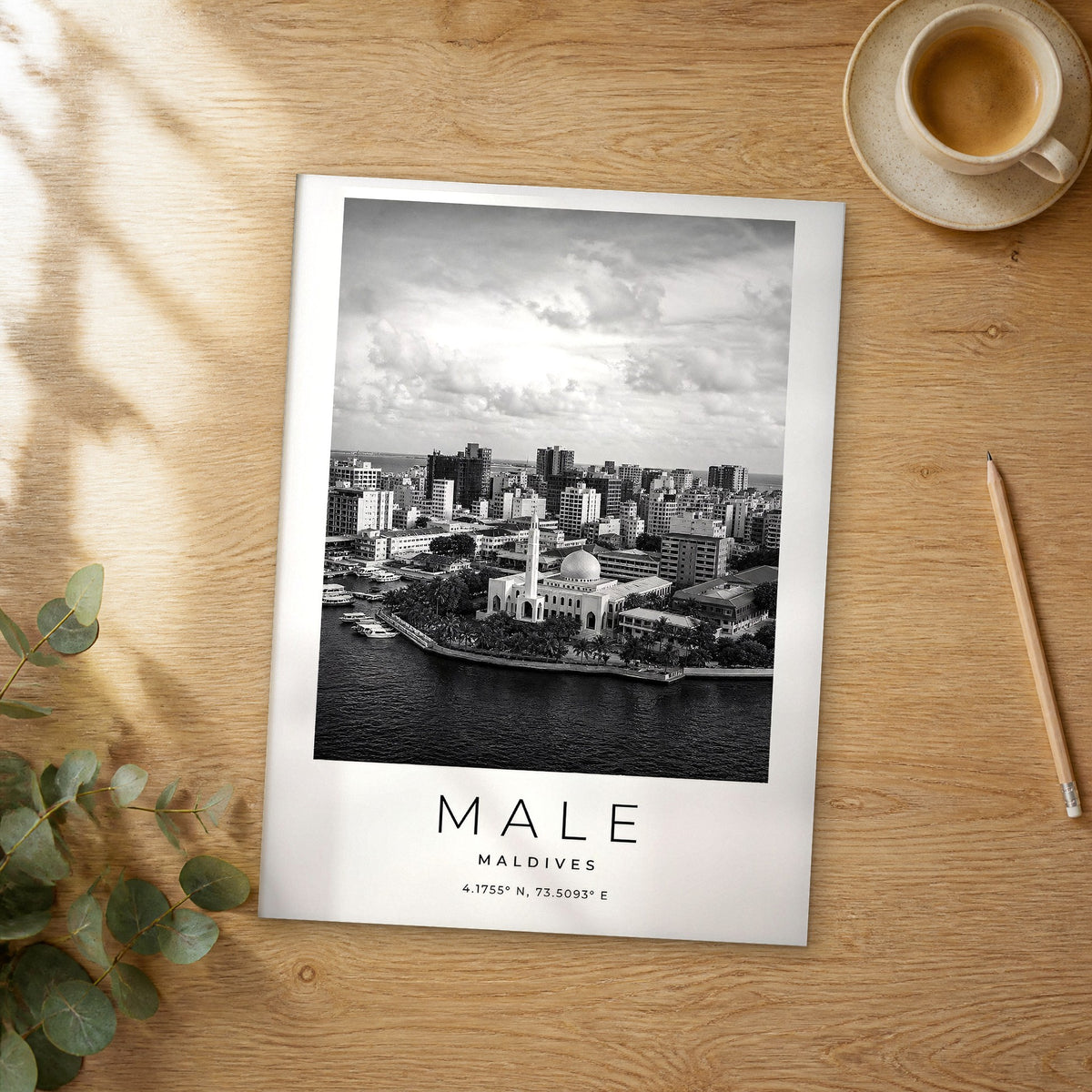 Unframed Male black and white travel poster on a wooden table