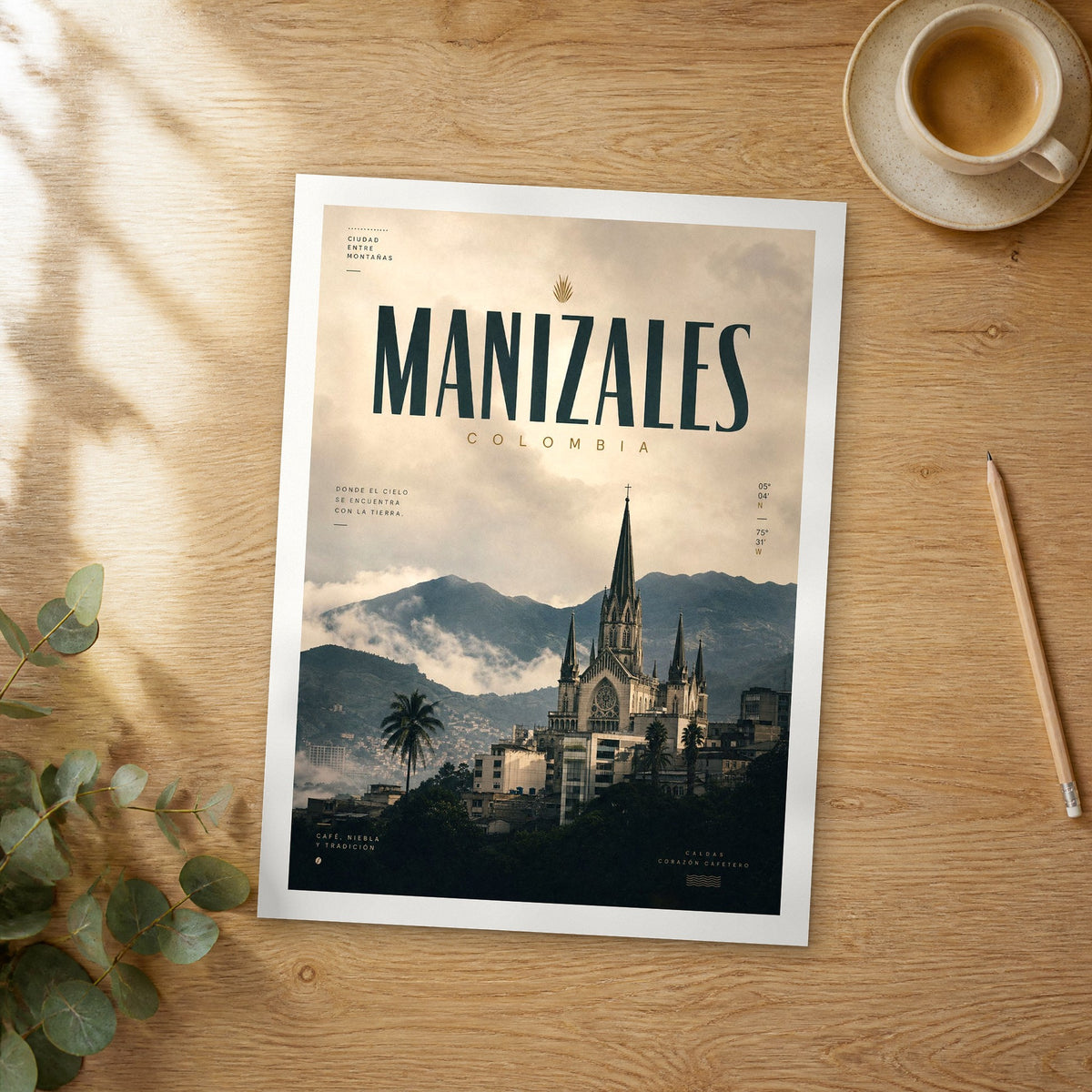 Unframed Manizales bold typography travel poster on a wooden table