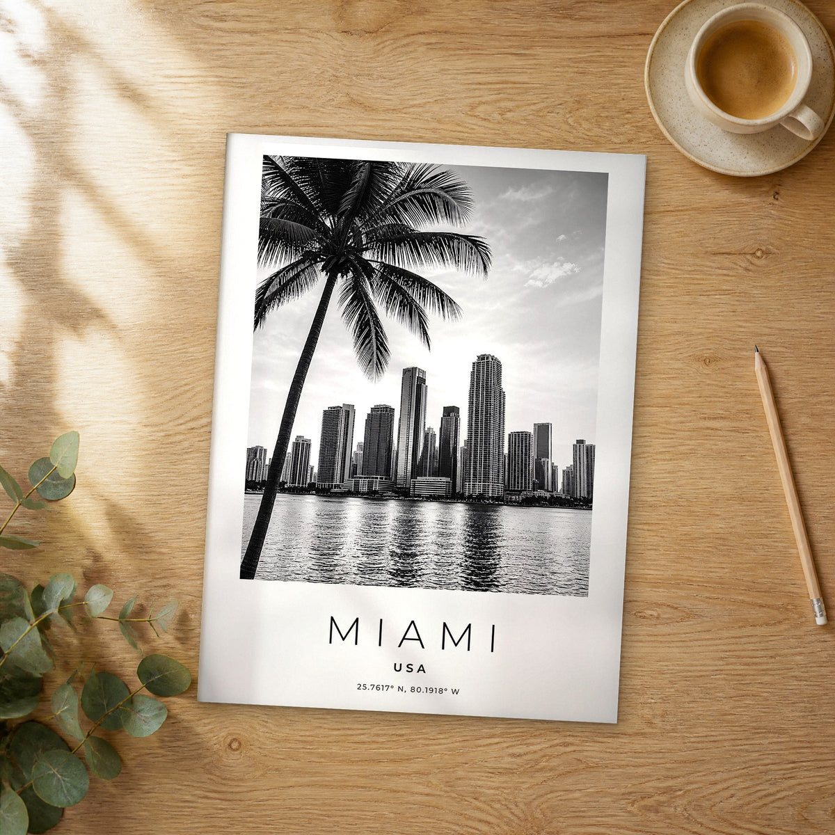 Unframed Miami black and white travel poster on a wooden table