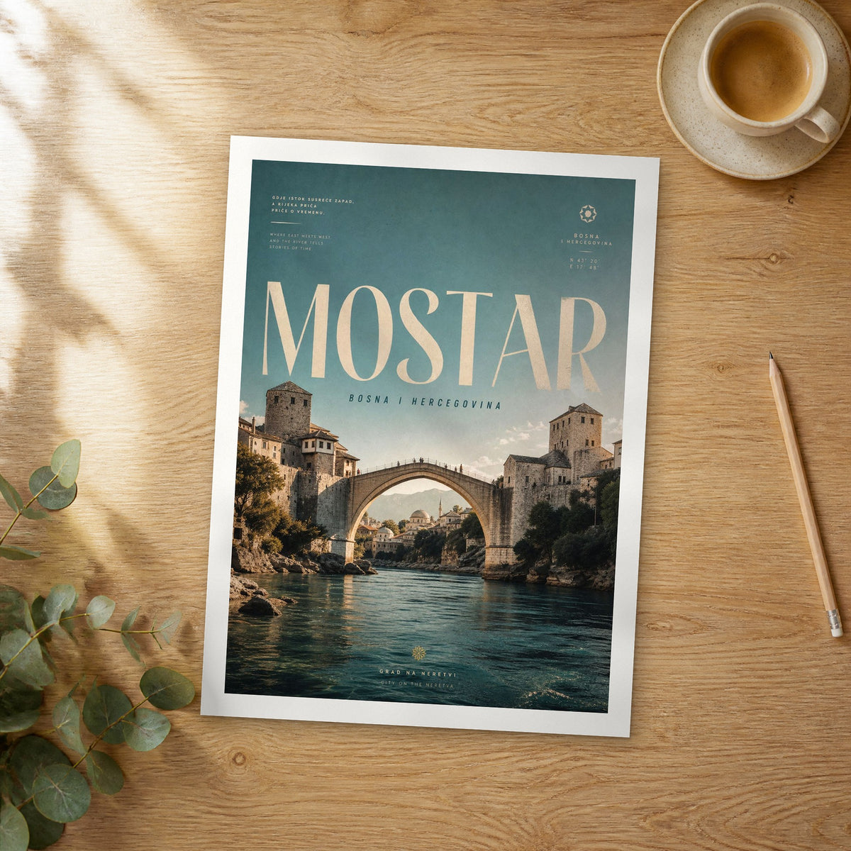 Unframed Mostar bold typography travel poster on a wooden table