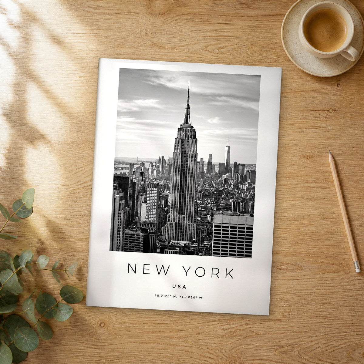 Unframed New York black and white travel poster on a wooden table