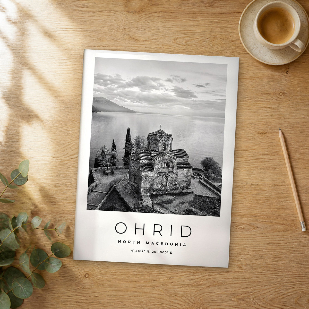 Unframed Ohrid black and white travel poster on a wooden table