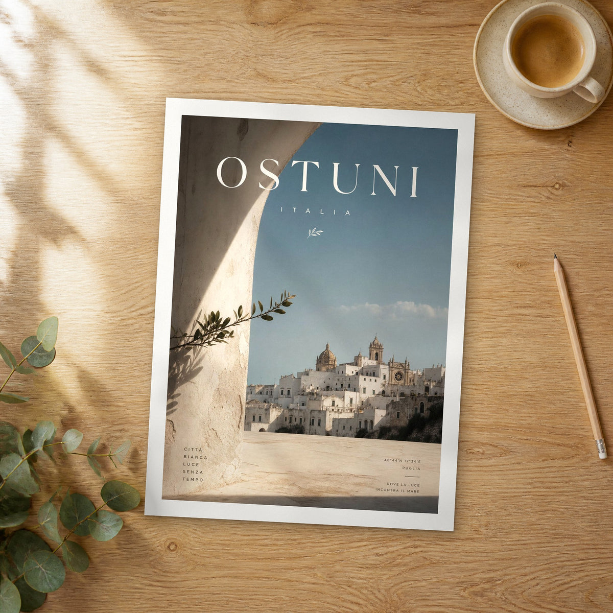 Unframed Ostuni bold typography travel poster on a wooden table
