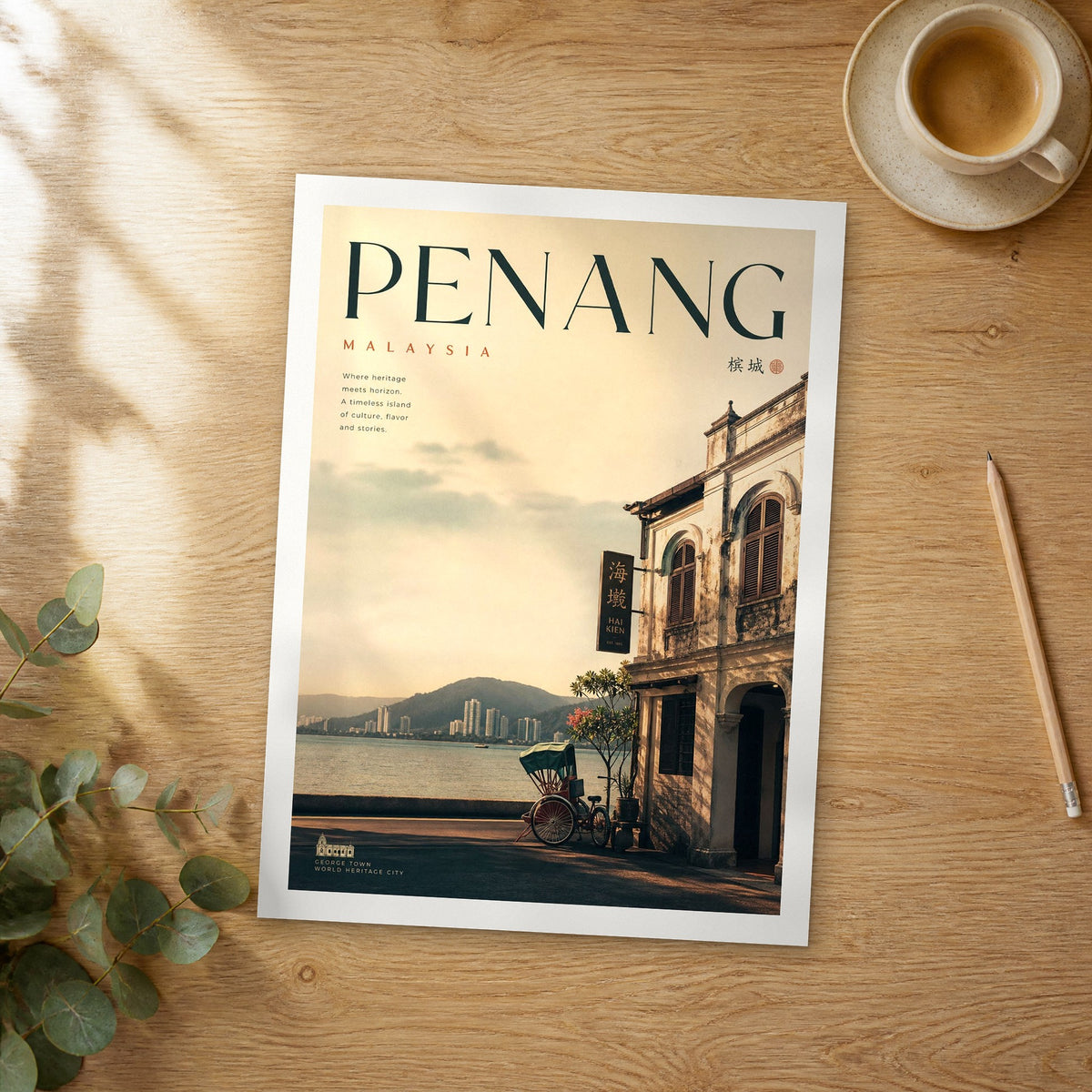 Unframed Penang bold typography travel poster on a wooden table