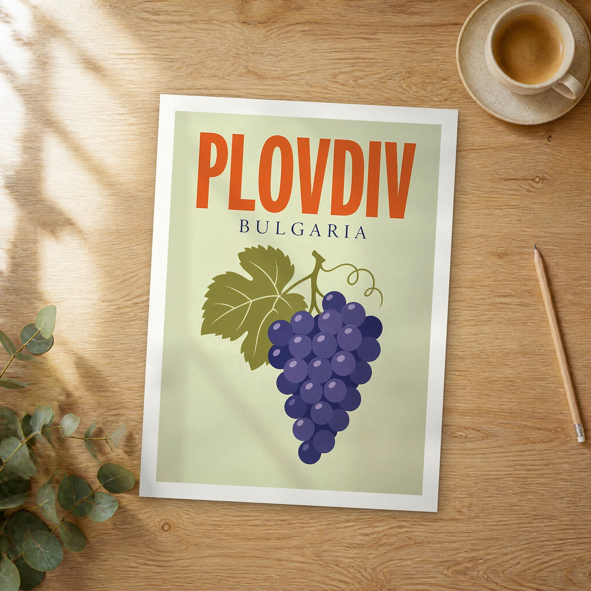 Unframed Plovdiv pop art travel poster on a wooden table
