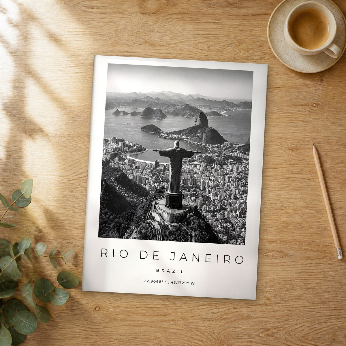 Unframed Rio de Janeiro black and white travel poster on a wooden table