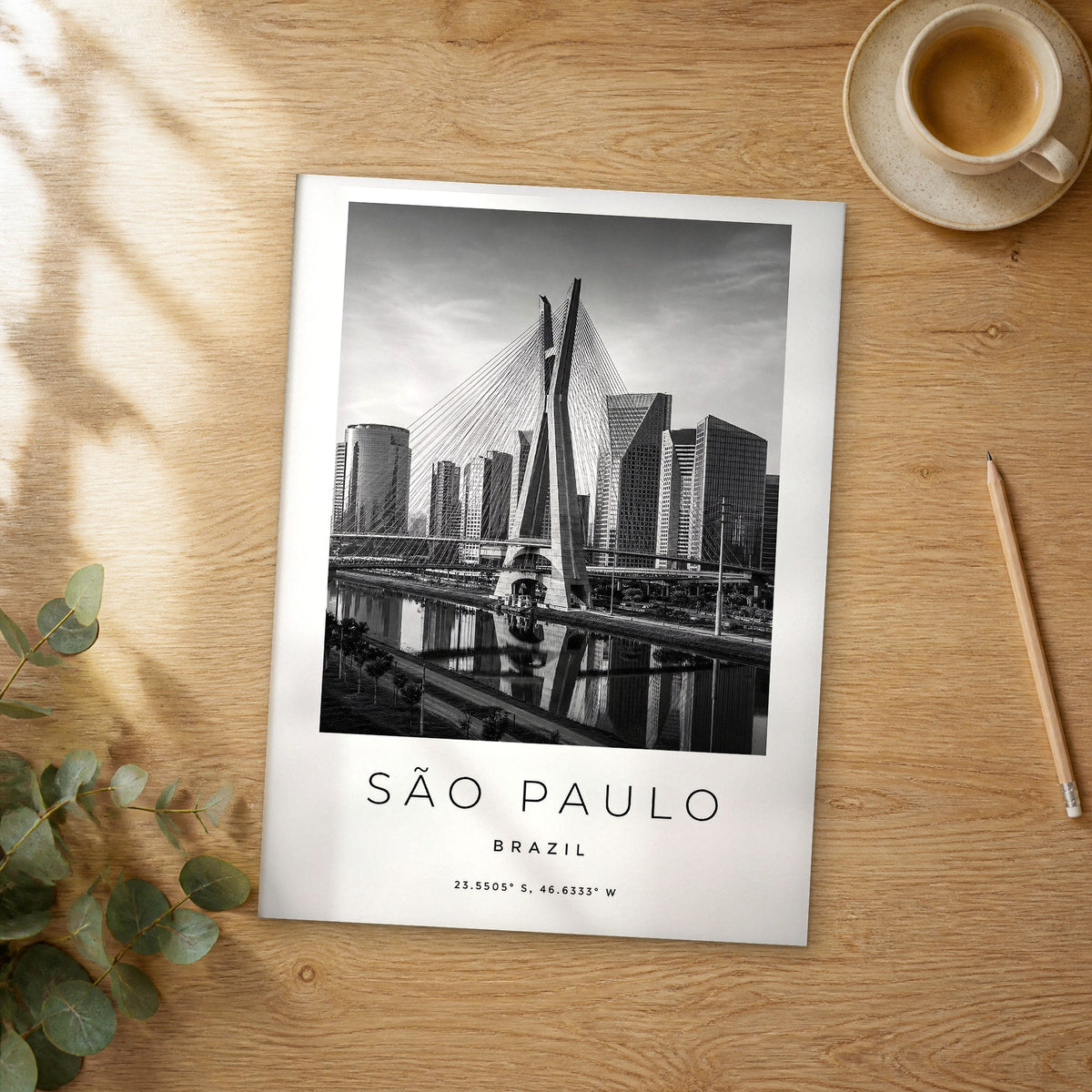 Unframed São Paulo black and white travel poster on a wooden table
