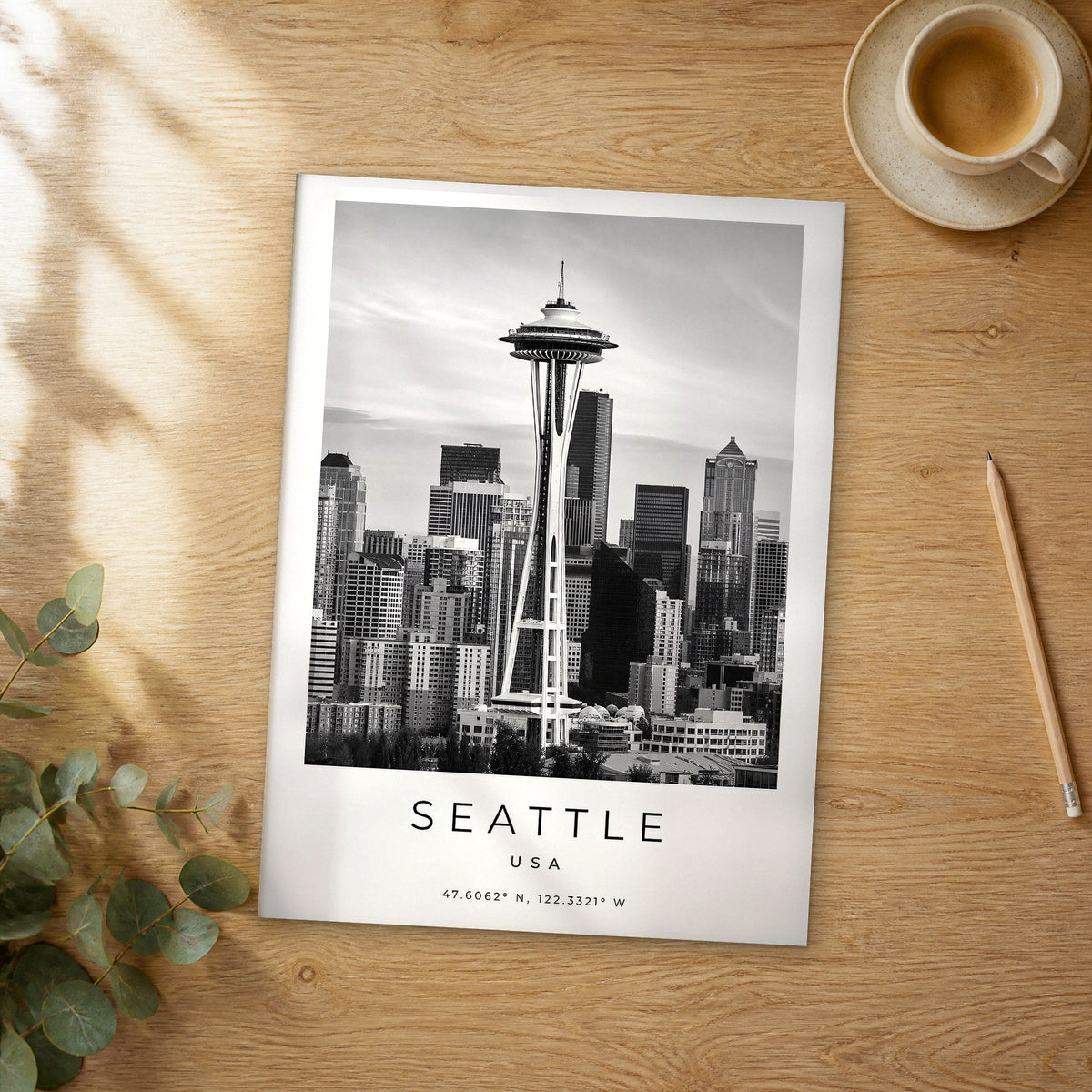 Unframed Seattle black and white travel poster on a wooden table