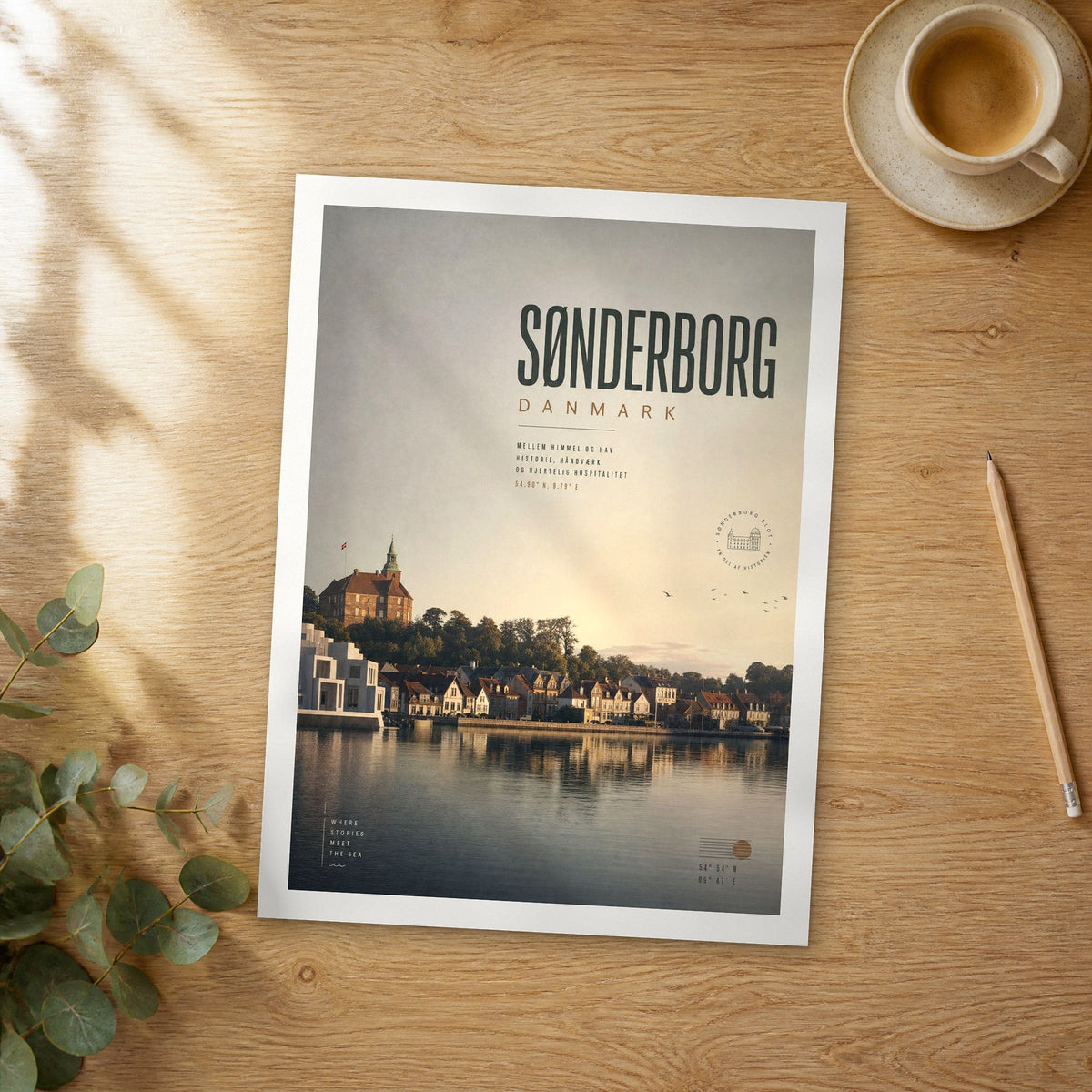 Unframed Sønderborg bold typography travel poster on a wooden table