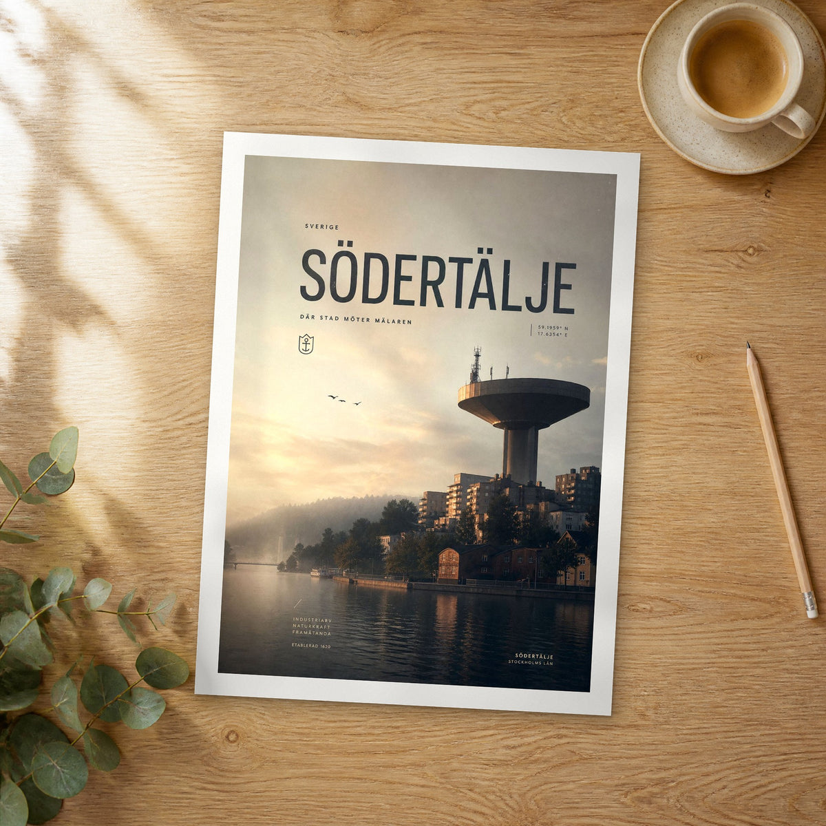 Unframed Södertälje bold typography travel poster on a wooden table