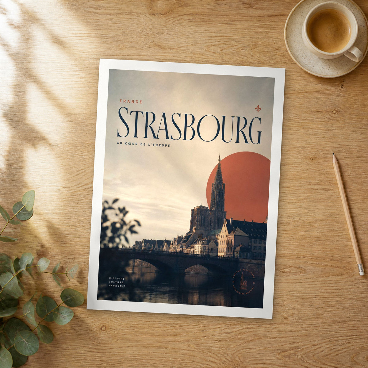 Unframed Strasbourg bold typography travel poster on a wooden table