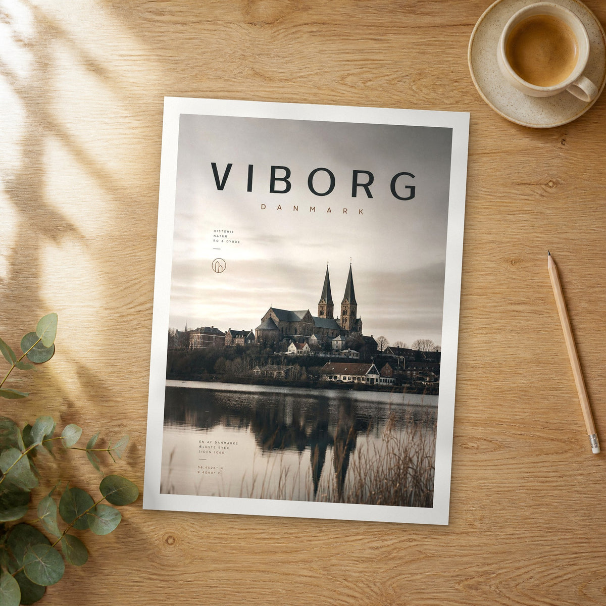 Unframed Viborg bold typography travel poster on a wooden table