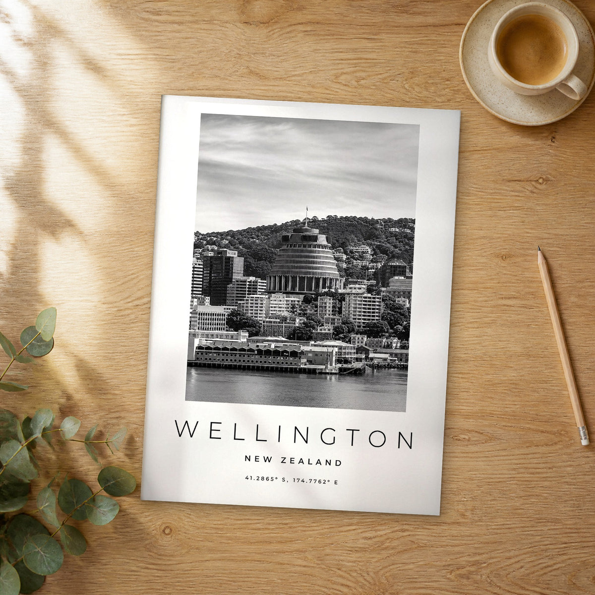 Unframed Wellington black and white travel poster on a wooden table