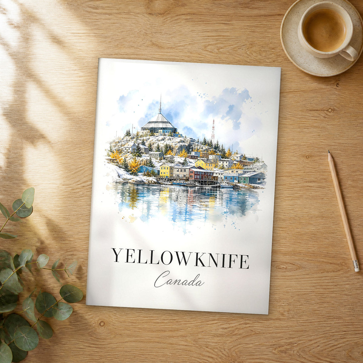 Unframed Yellowknife watercolor travel poster on a wooden table