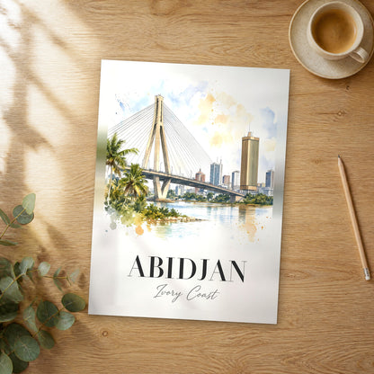 Unframed Abidjan watercolor travel poster on a wooden table