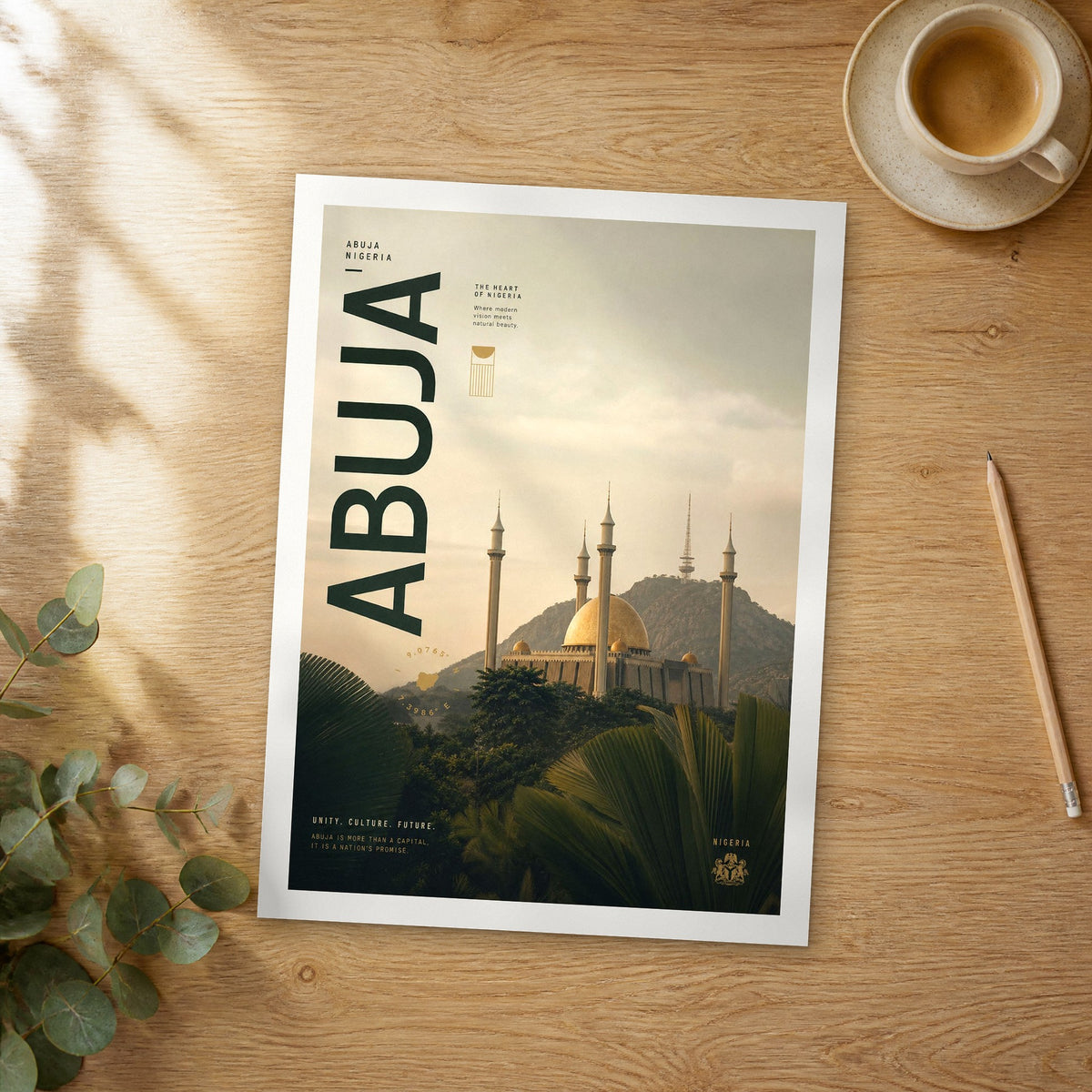 Unframed Abuja bold typography travel poster on a wooden table