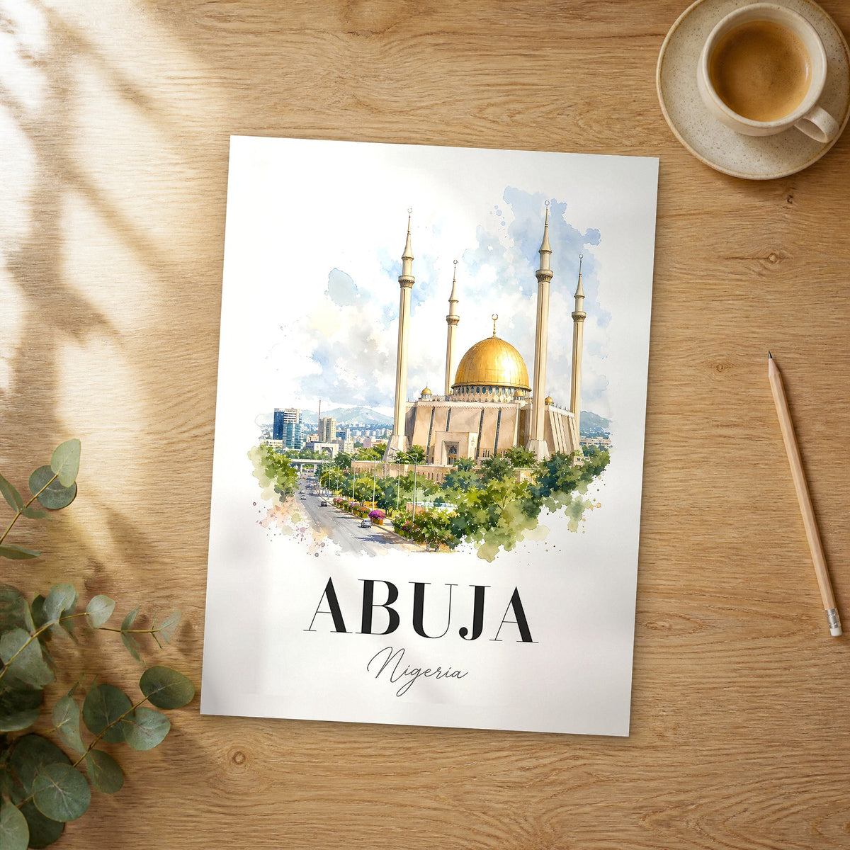 Unframed Abuja watercolor travel poster on a wooden table
