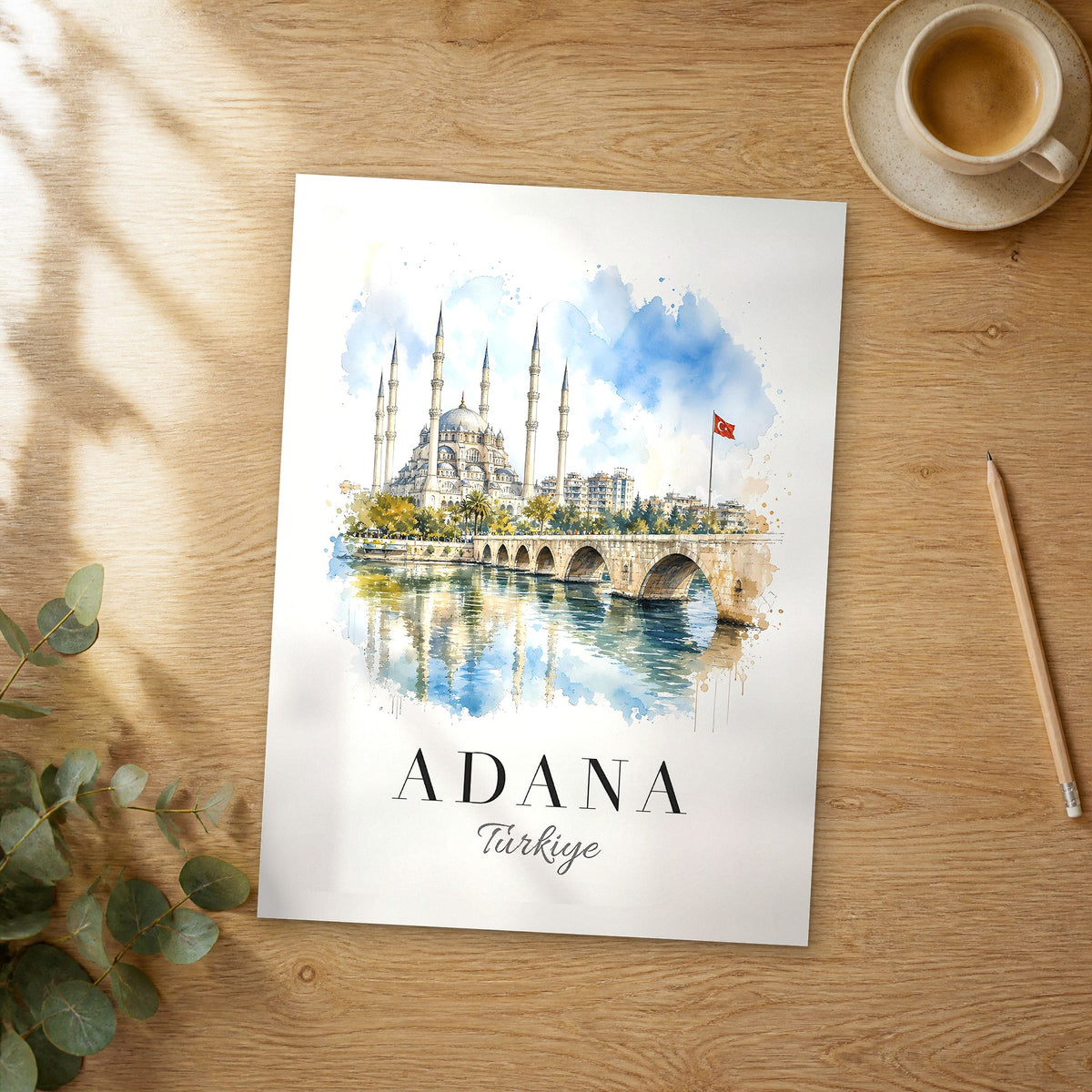 Unframed Adana watercolor travel poster on a wooden table