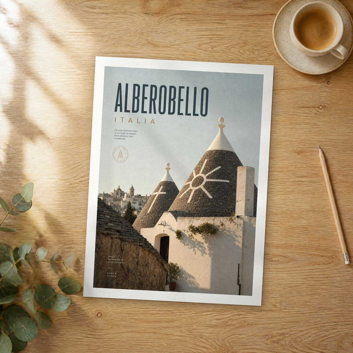 Unframed Alberobello bold typography travel poster on a wooden table