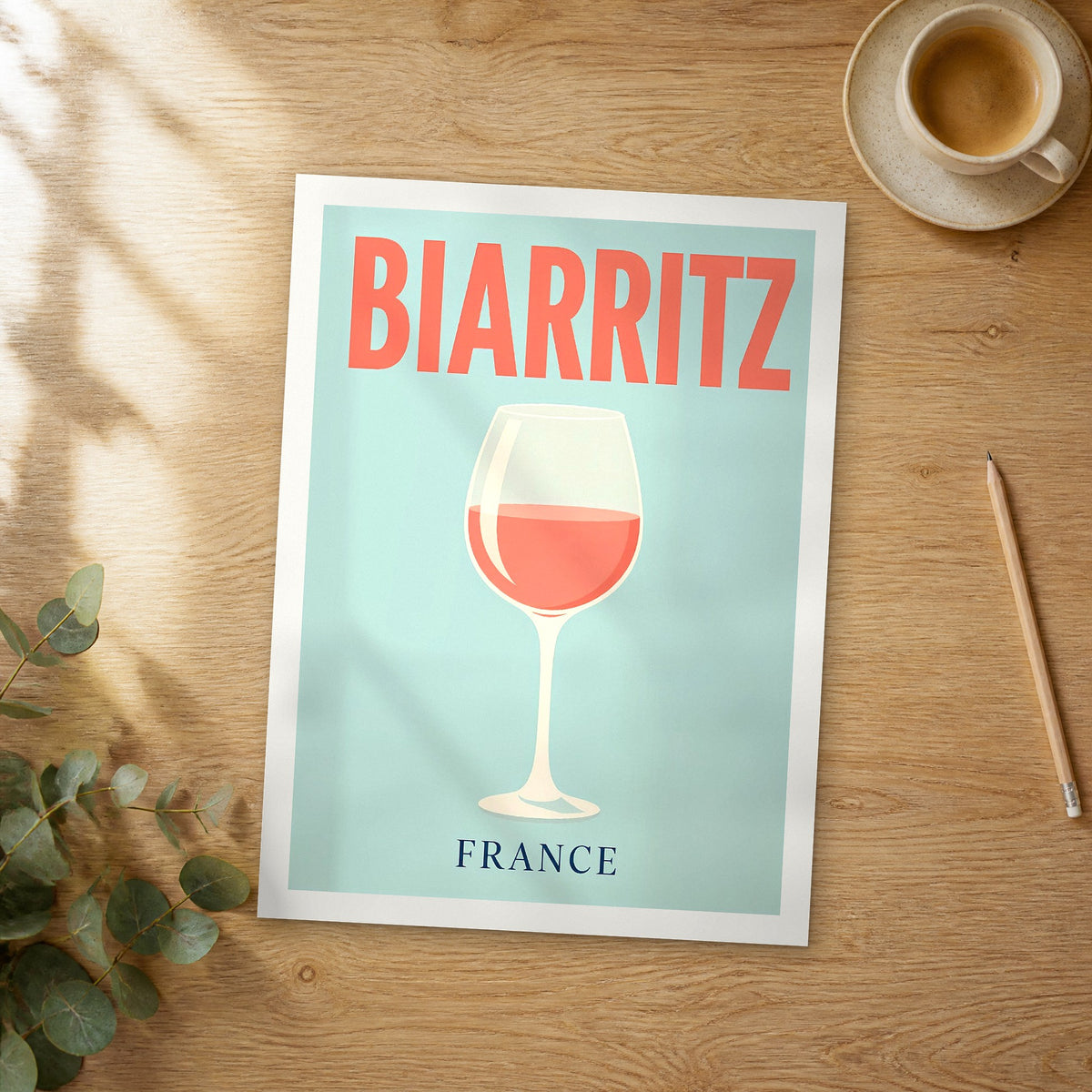 Unframed Biarritz pop art travel poster on a wooden table