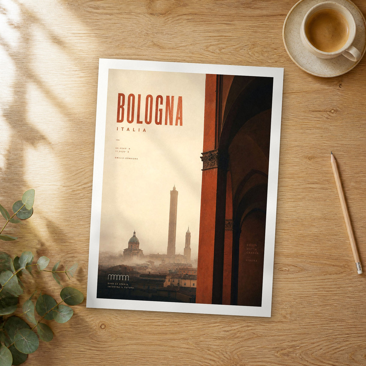 Unframed Bologna bold typography travel poster on a wooden table
