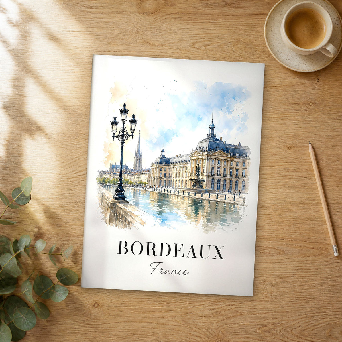 Unframed Bordeaux watercolor travel poster on a wooden table