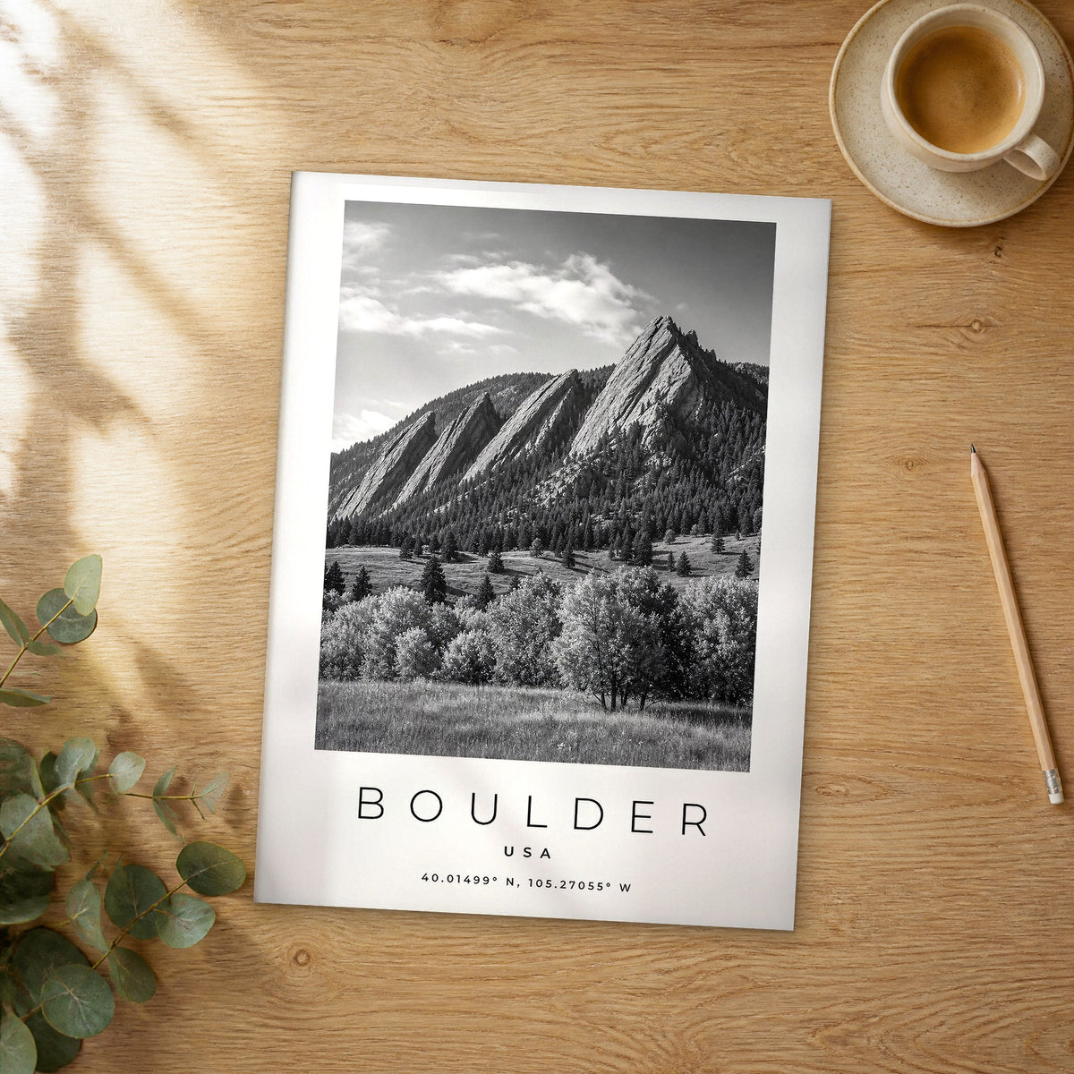 Unframed Boulder black and white travel poster on a wooden table