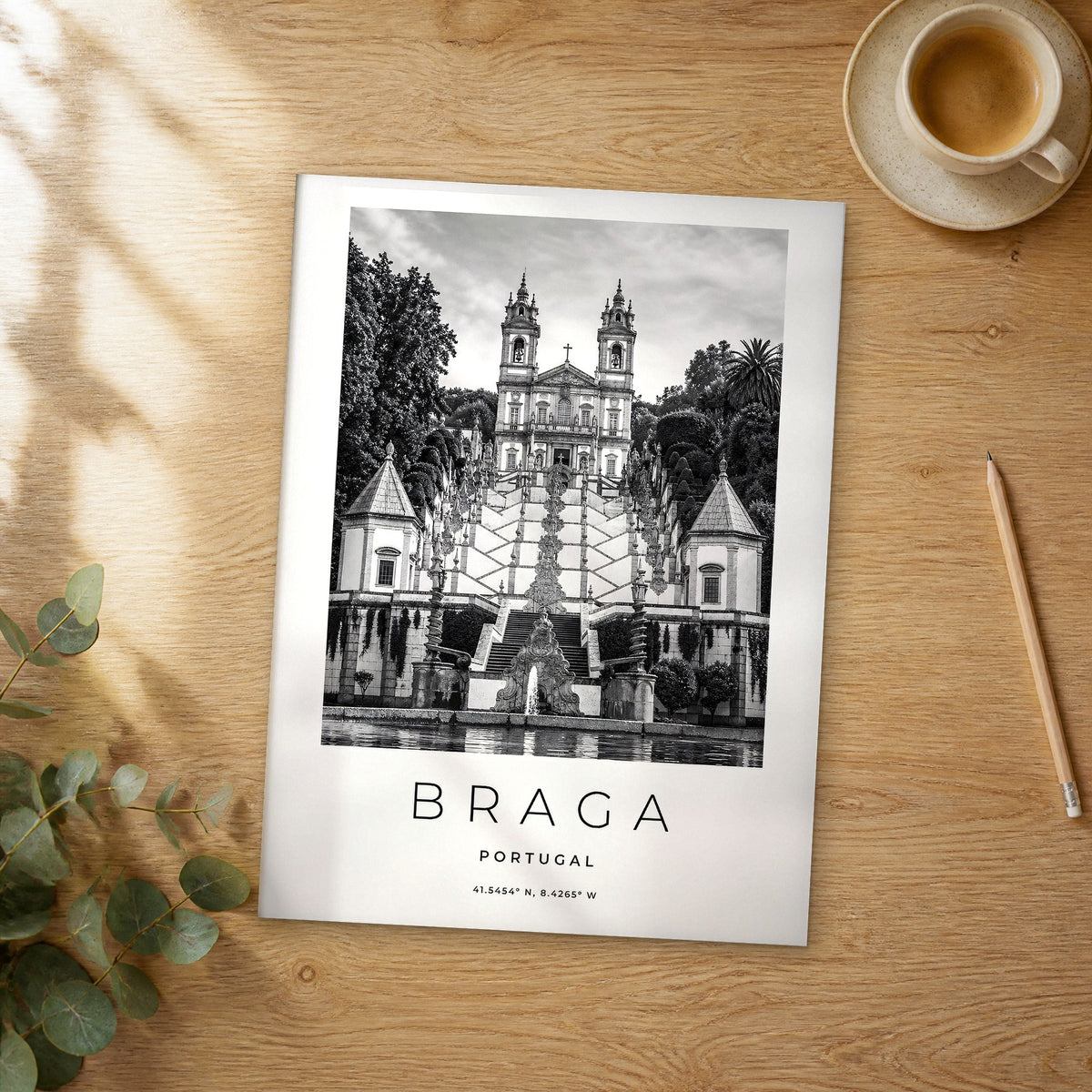 Unframed Braga black and white travel poster on a wooden table
