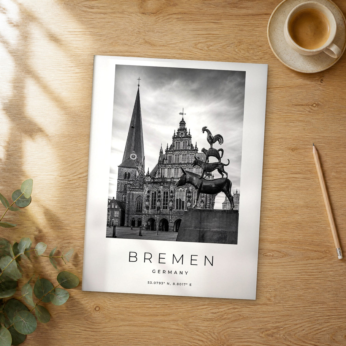 Unframed Bremen black and white travel poster on a wooden table