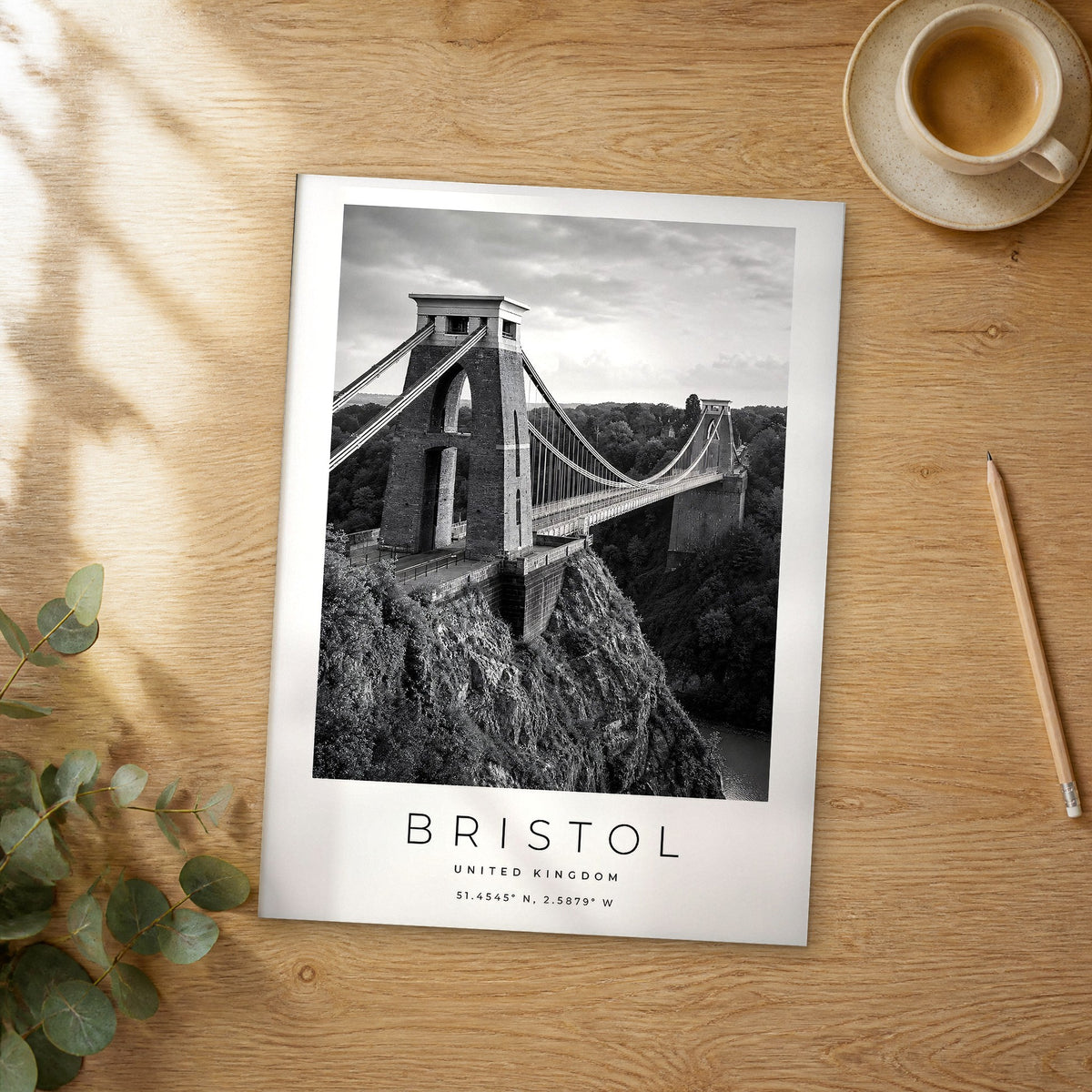Unframed Bristol black and white travel poster on a wooden table