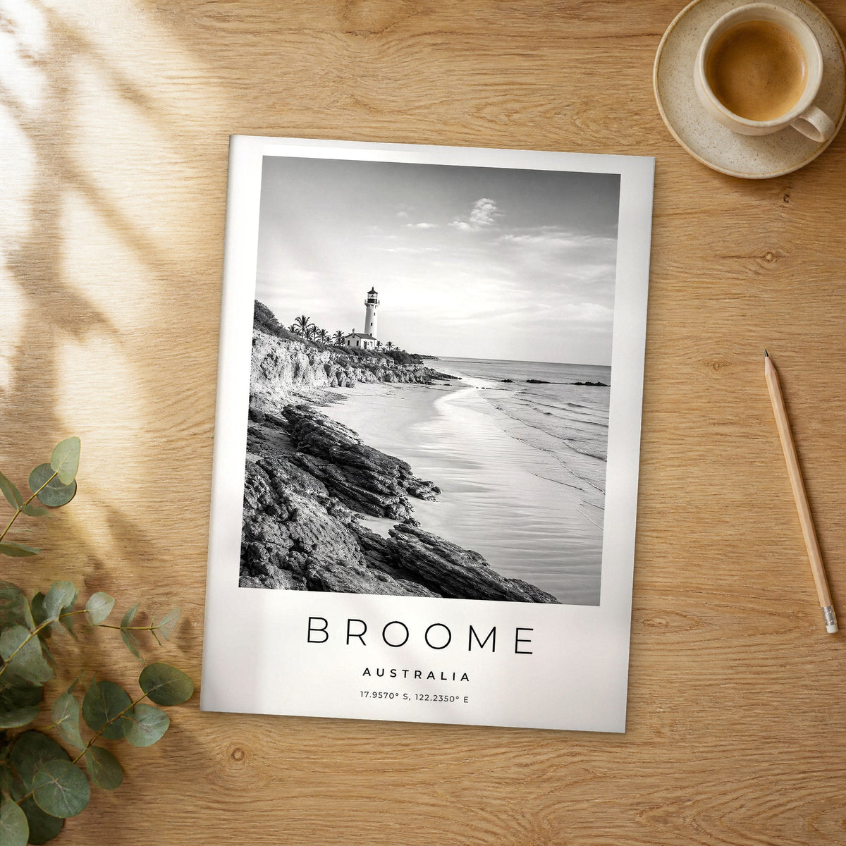 Unframed Broome black and white travel poster on a wooden table
