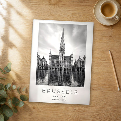 Unframed Brussels black and white travel poster on a wooden table