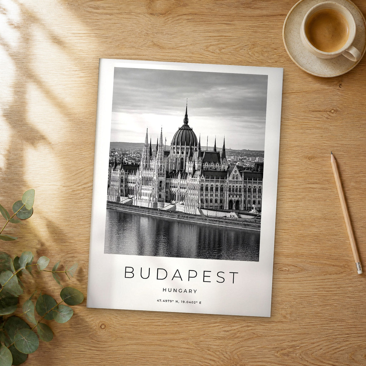 Unframed Budapest black and white travel poster on a wooden table
