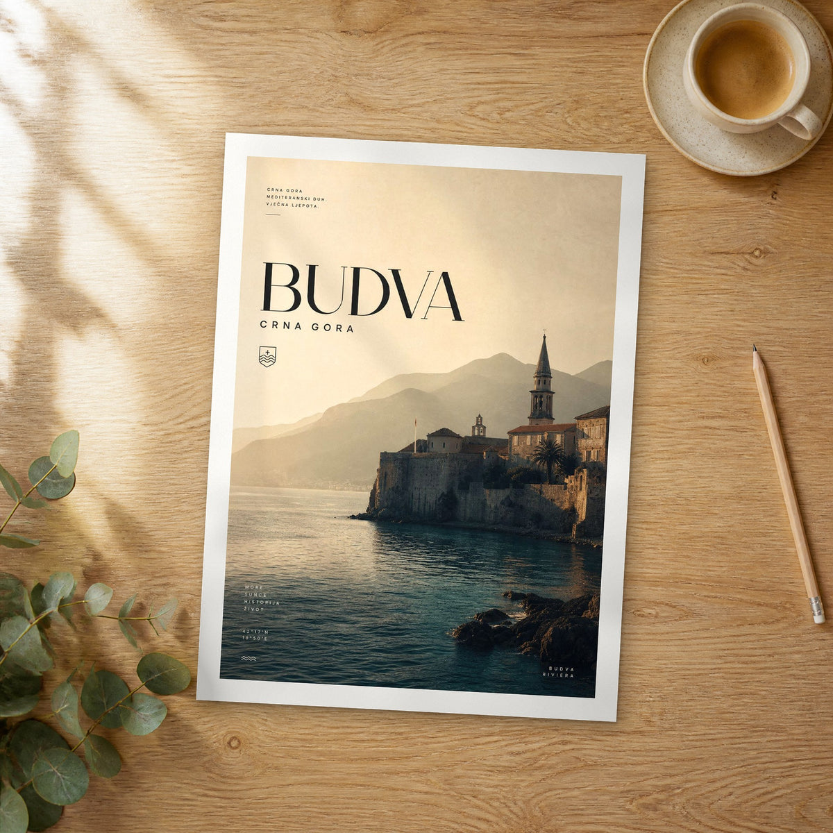 Unframed Budva bold typography travel poster on a wooden table