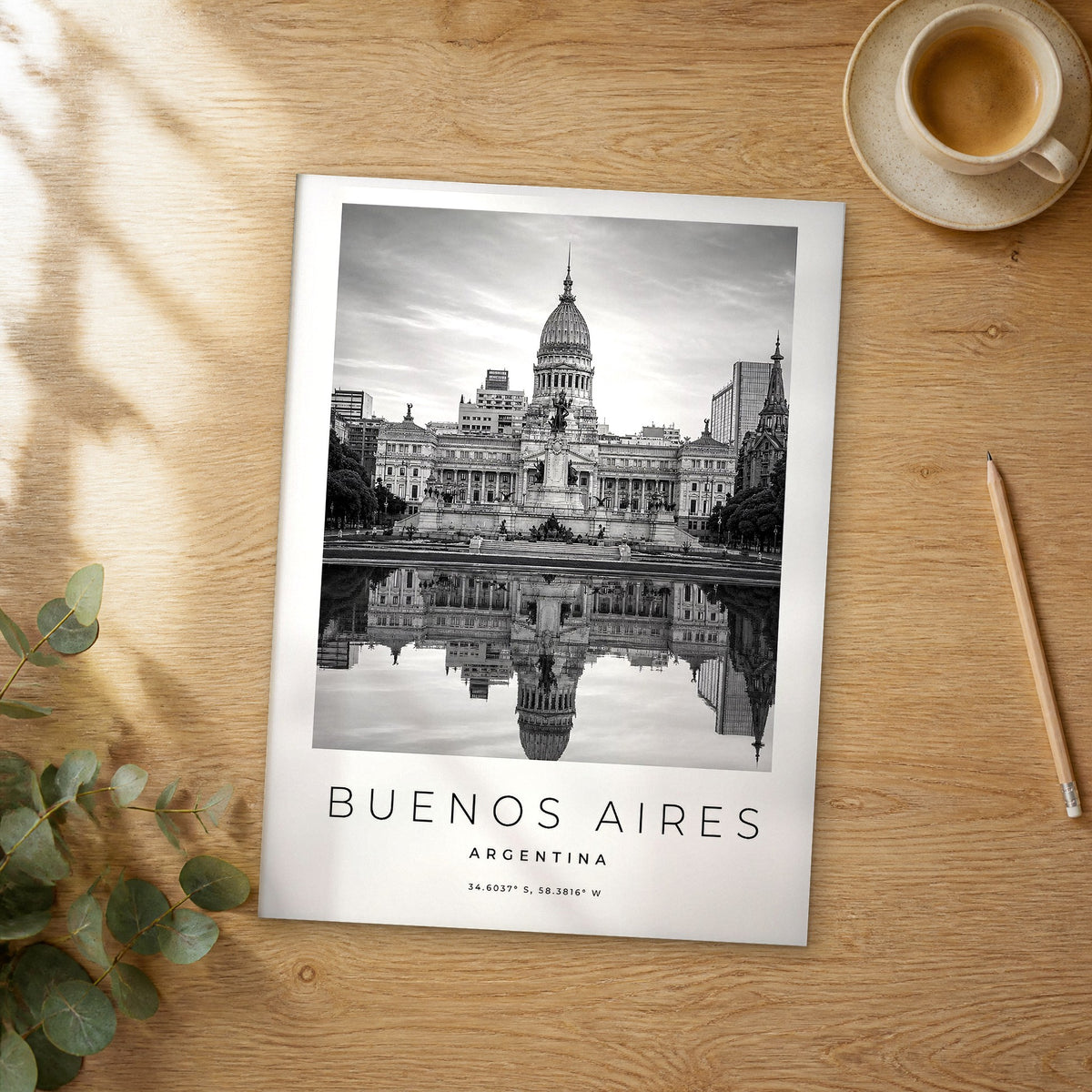 Unframed Buenos Aires black and white travel poster on a wooden table