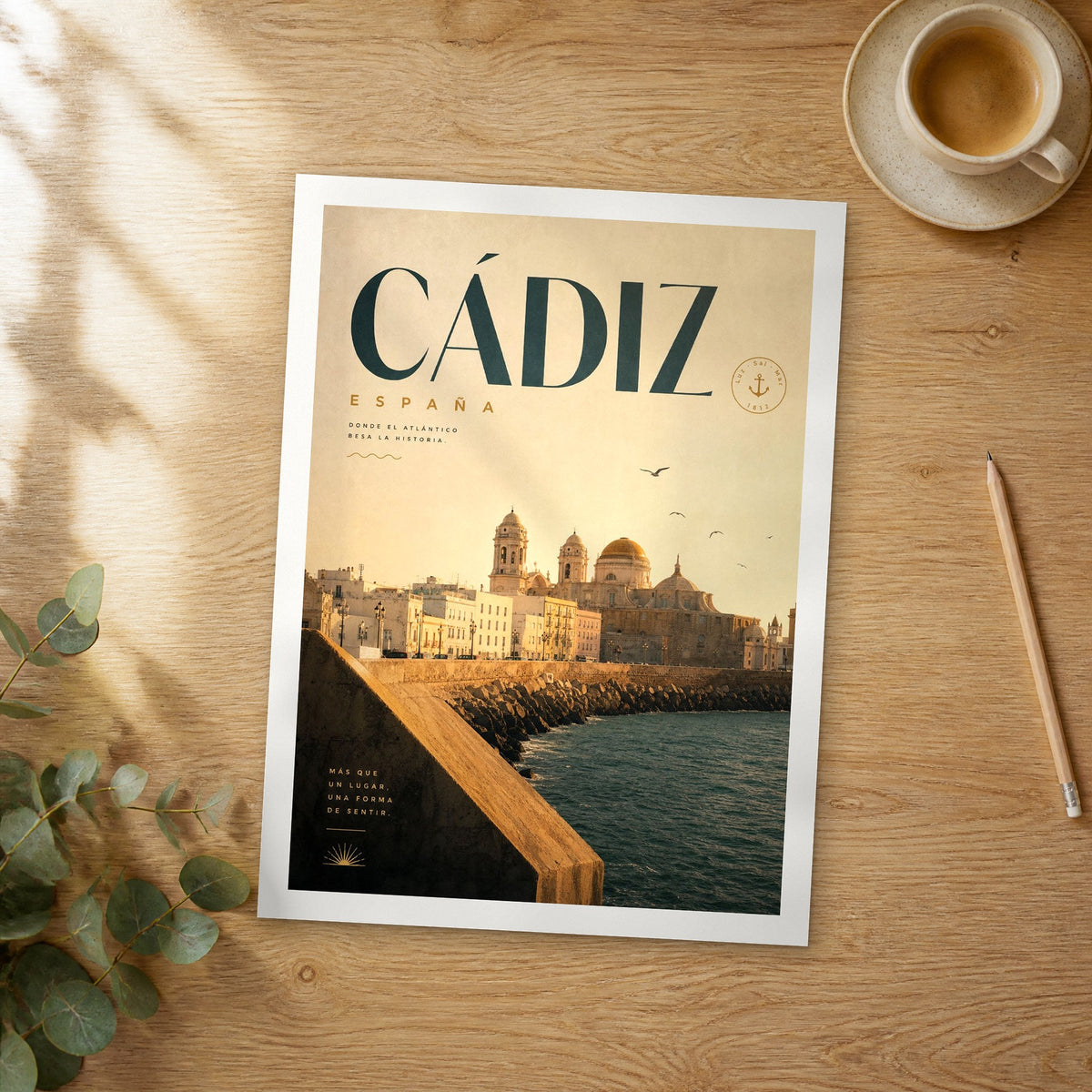 Unframed Cádiz bold typography travel poster on a wooden table
