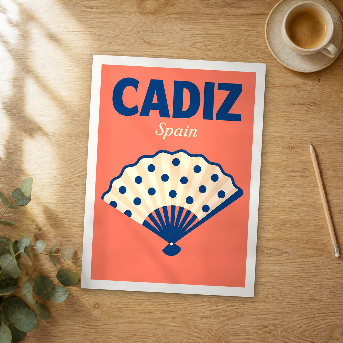 Unframed Cadiz pop art travel poster on a wooden table