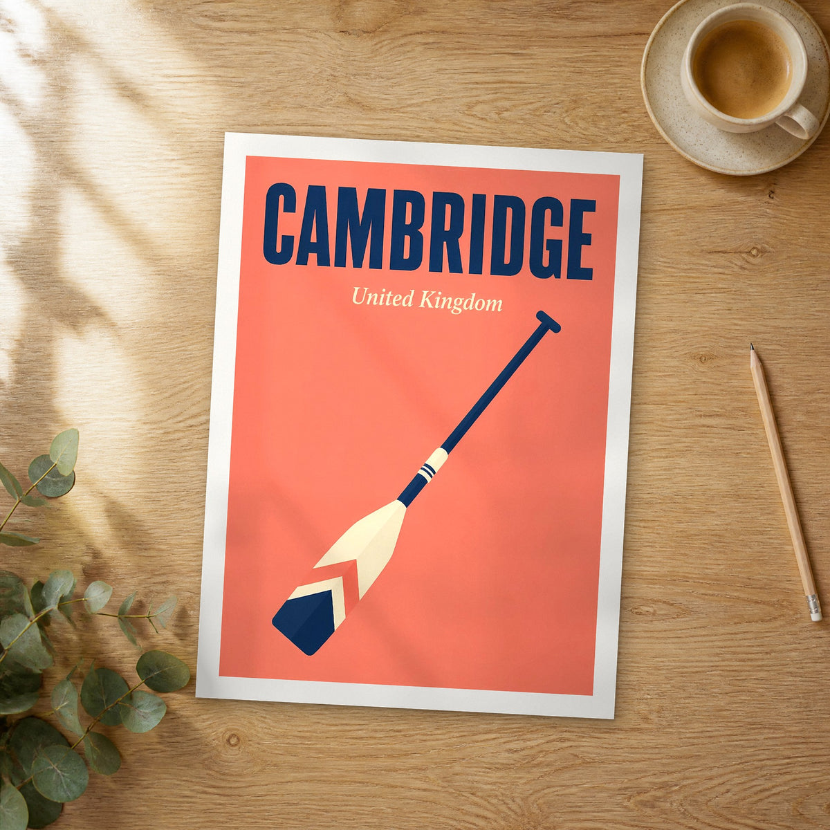 Unframed Cambridge pop art travel poster on a wooden table
